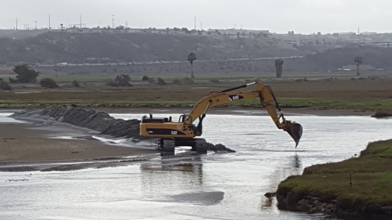 Excavating and stockpiling in the main northern channel at Los Peñasquitos Lagoon.  Photo by M. Hastings.